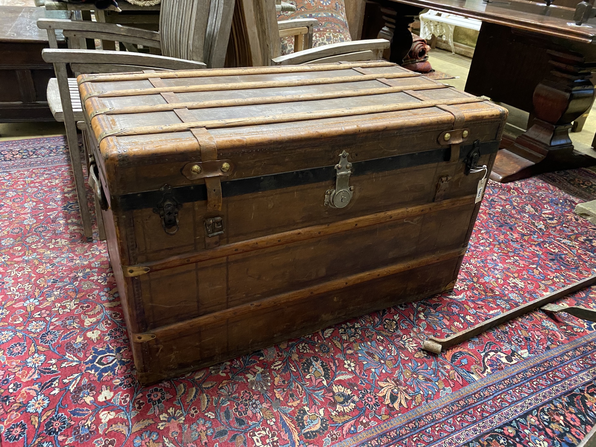 A late 19th century French travelling trunk with interior paper label “A. Bertrand, Paris”, length 106cm, width 60cm, height 66cm
